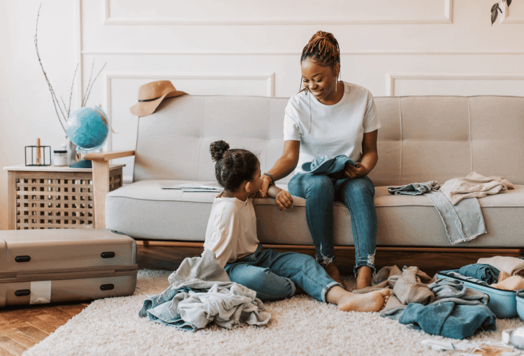 mom and daughter sitting on couch together